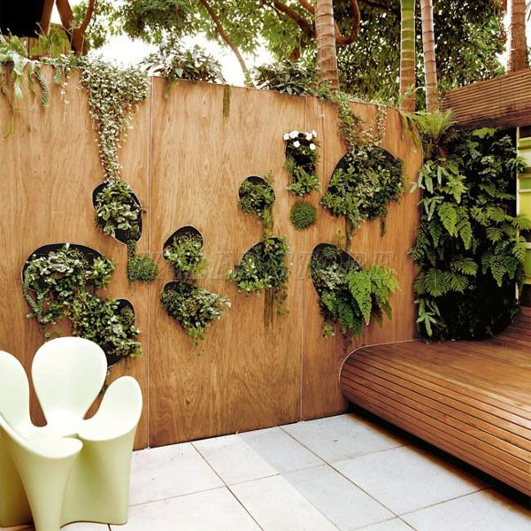 tao-nhung-o-cay-xanh-tren-tuong-san-vuon